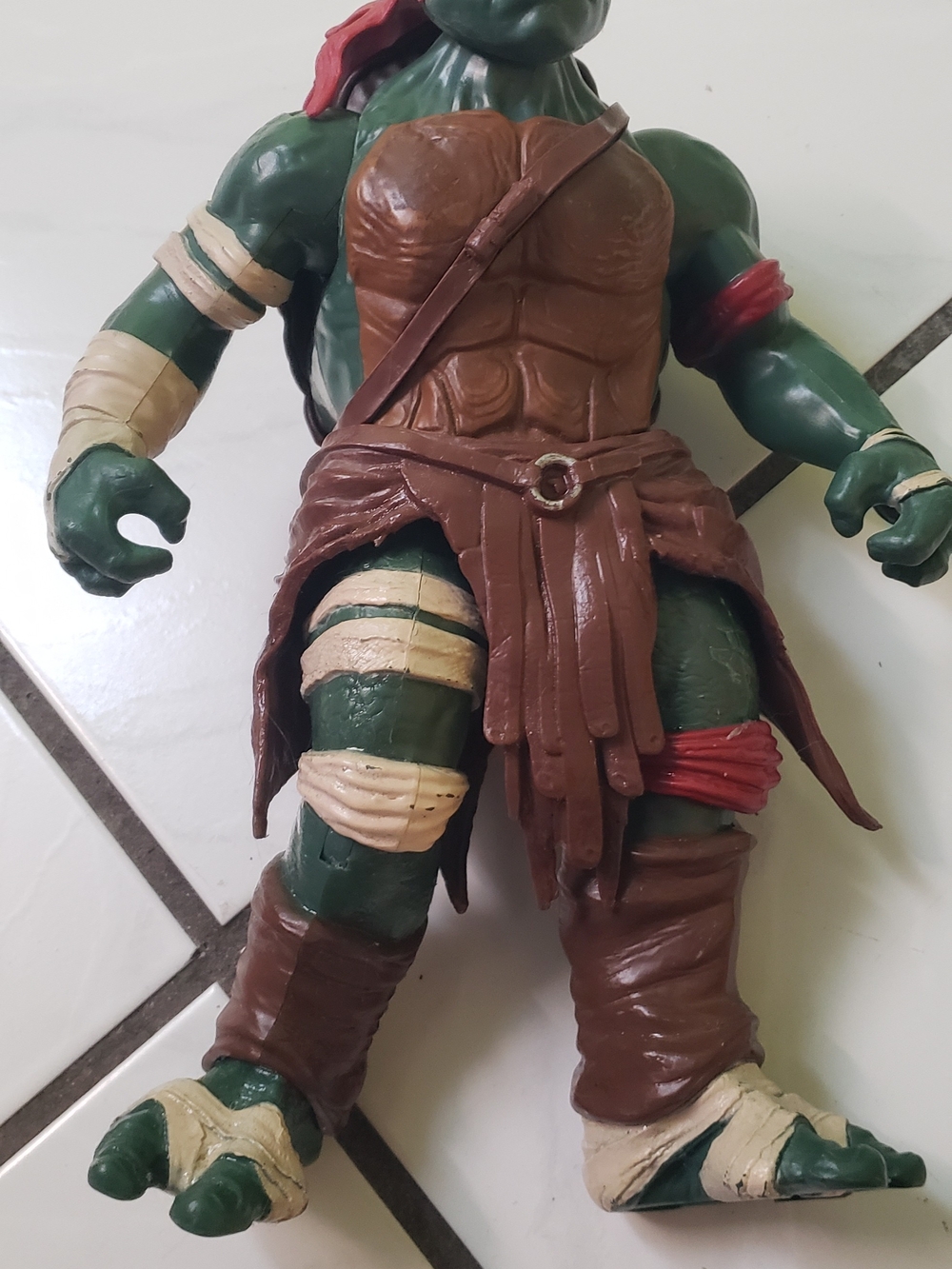 Vintage "Ninja Turtle" Warrior action figure, green with brown armor